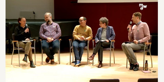 Five people sitting for roundtable discussion