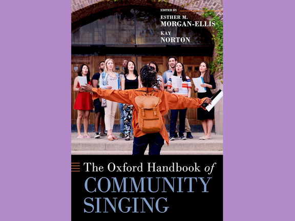 cover of handbook showing a community choir in front of a building